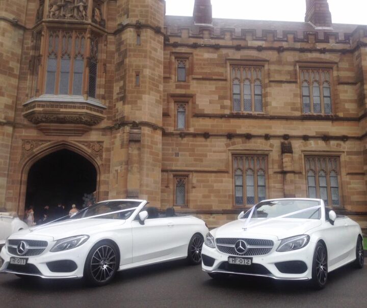 Identical Mercedes convertibles out the front of the church during the wedding service.
