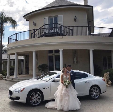 Our bride & groom pictured with our stunning Maserati Wedding Car