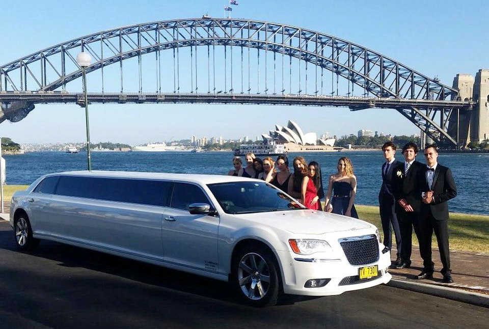 Iconic shot under the Sydney harbour bridge with our Chrysler stretch limo and school formal attendees dressed to impress.