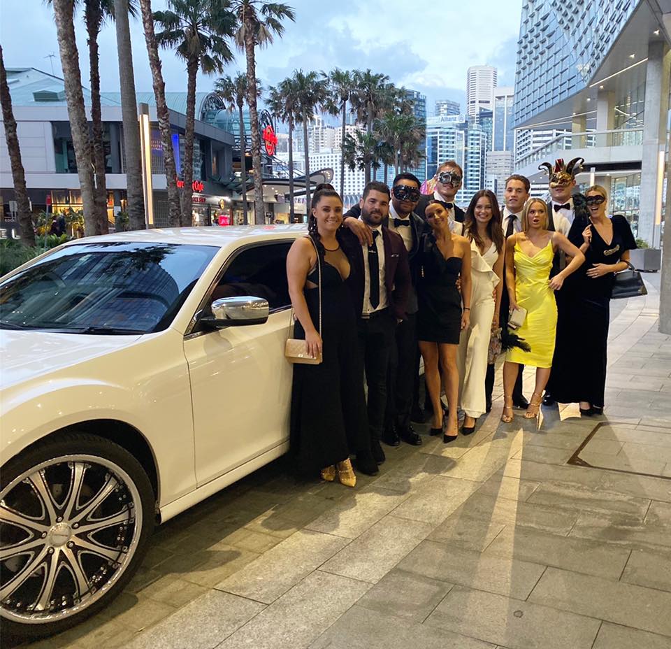 South Sydney Rabbitohs players & their partners travel in style to the Red and Green Ball. Pictured with our stretch limo.