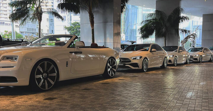 Multiple chauffeured vehicles lined up for event transport