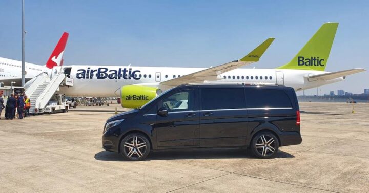 HF Wedding & Hire Cars proudly provided transport for VIP guests for the launch of the new Airbus A220 in October 2019. Our Mercedes V-Class SUV in front of the new airBaltic airplane.